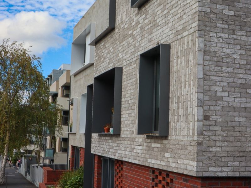 Photograph of medium density social housing in the City of Hobart. Access to the front door is not universally accessible from the street.